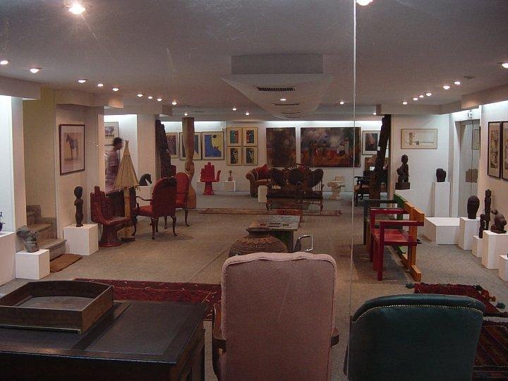 Art Galleries Lahore featuring a spacious exhibition hall with contemporary paintings, sculptures, and elegant interior displays.